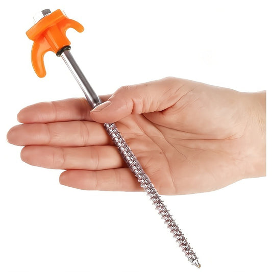 One screw-in tent stake with an orange hook lying across an open hand, showing its length against the palm