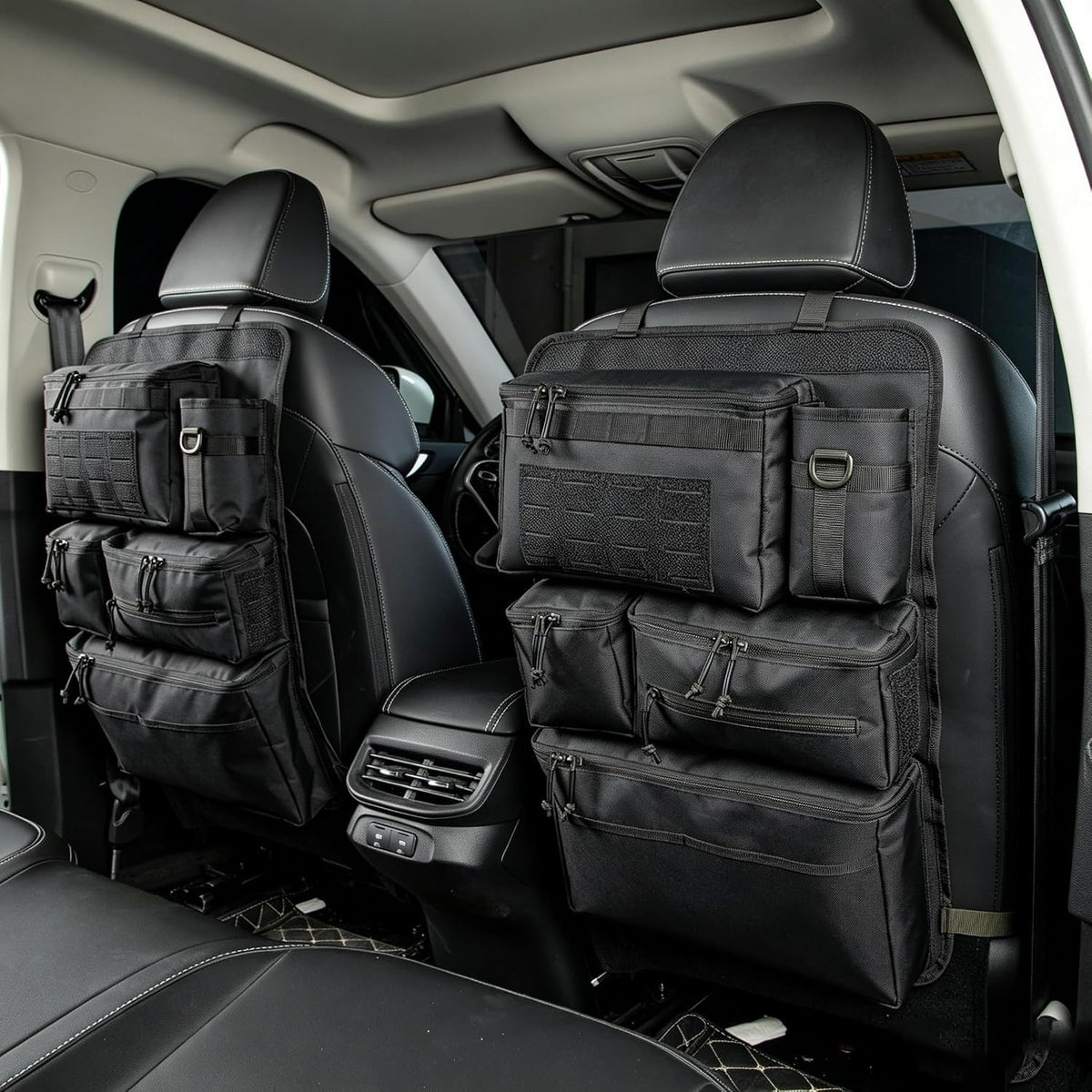 Two black seat-back organizers fitted to both front seats, seen from the back seat